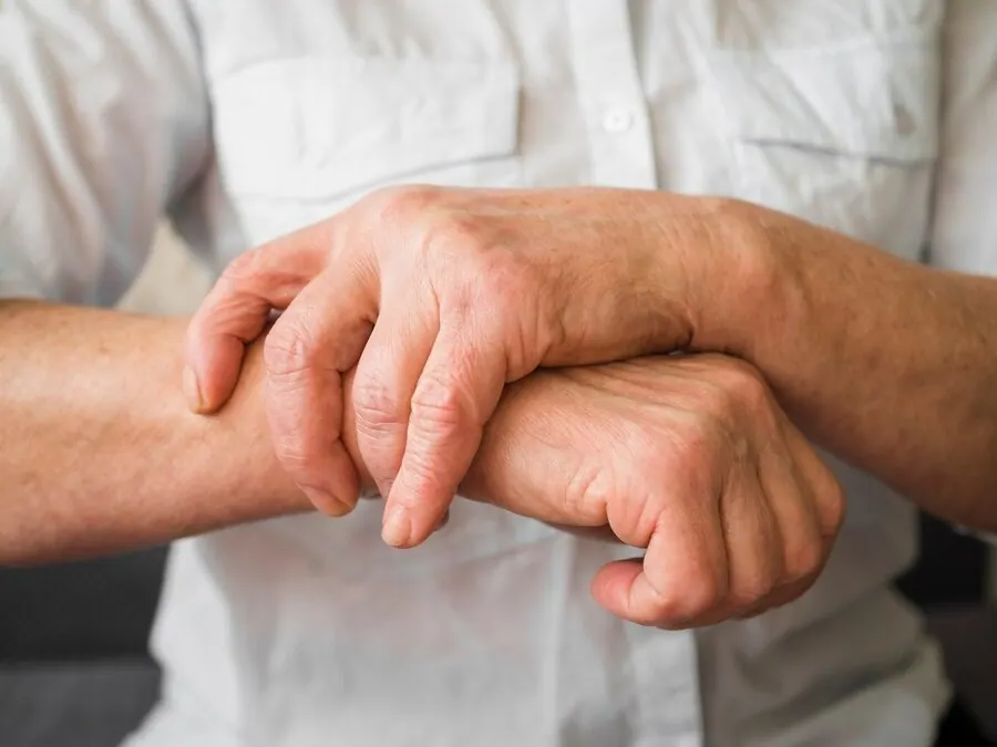 Close-up of hands holding a wrist