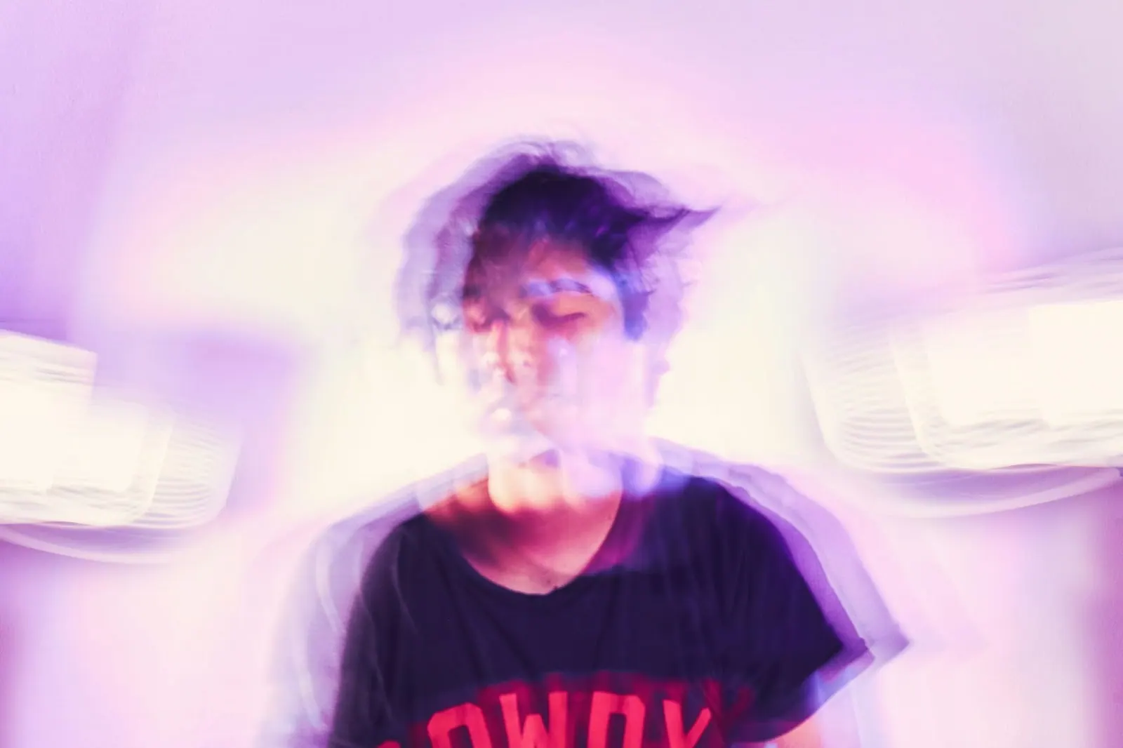Person with a blurred, dizzy effect