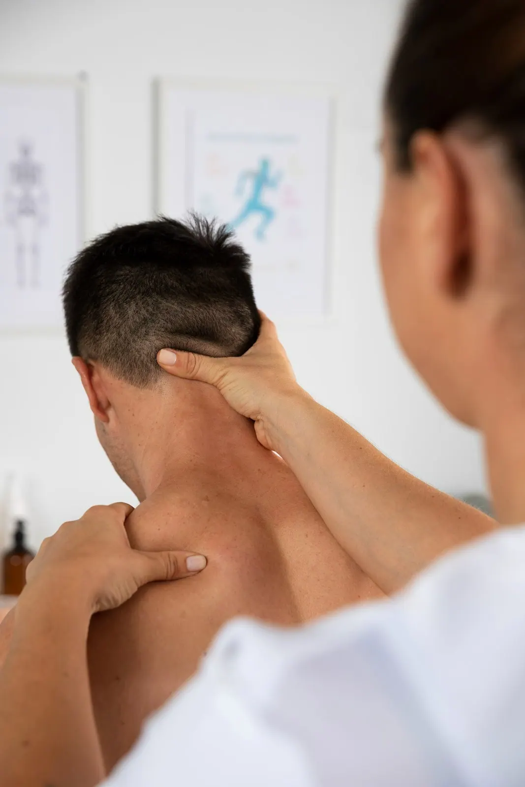 Practitioner checking the back of a patient's neck