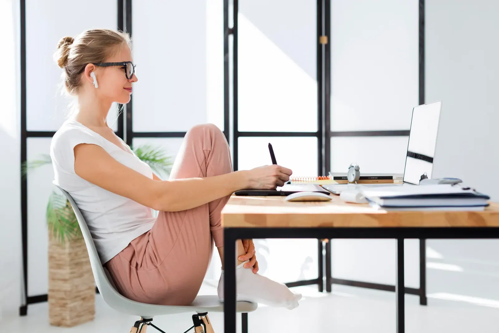Woman working at a desk at home