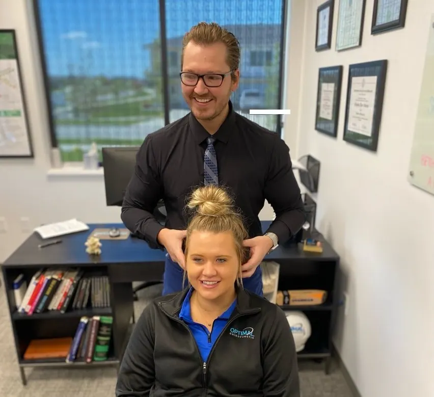 Dr. Barney and Amanda, chiropractic neck pain adjustment