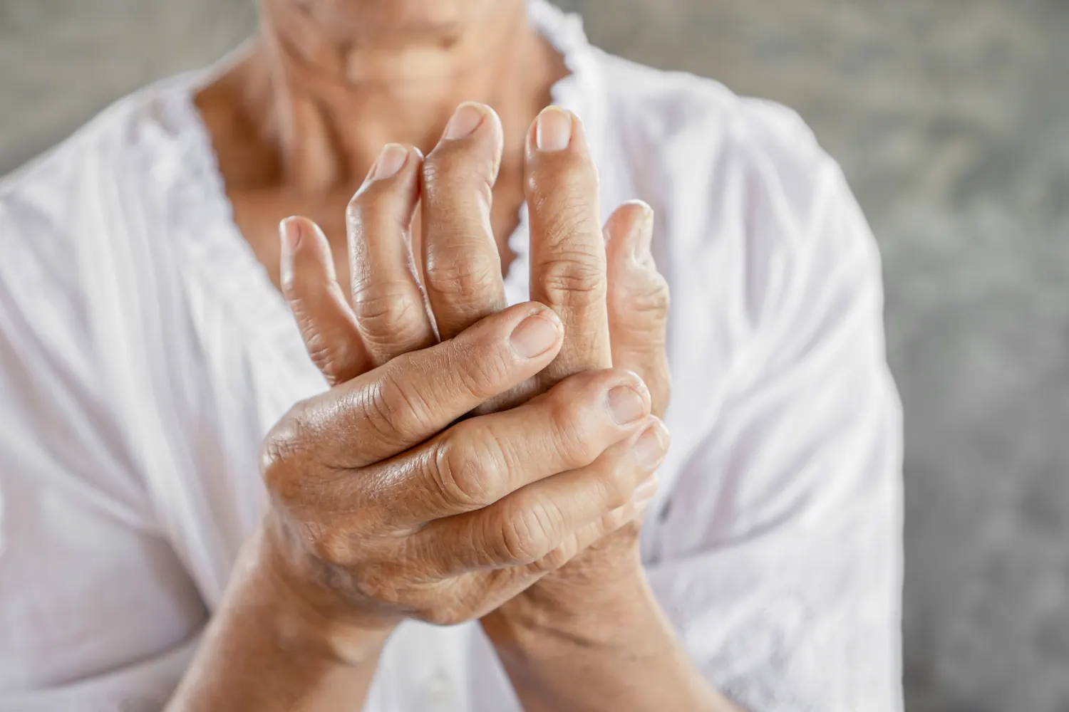 old woman suffer arthritis pain in her hands