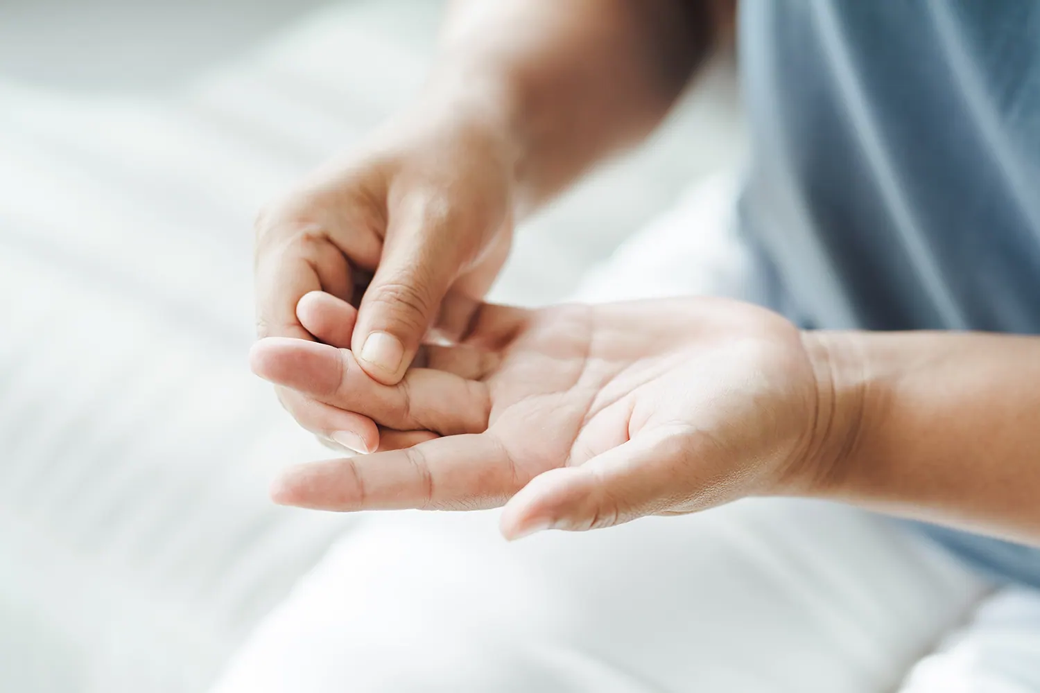 Close-up of a person rubbing the palm of their hand