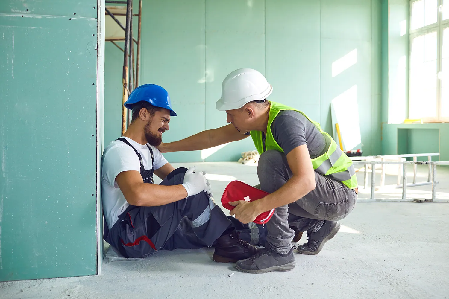 two men worker, one got work injury pain